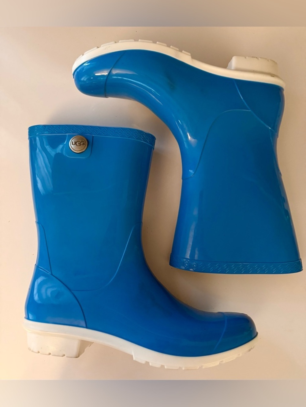 UGG cobalt blue rubber rain boots. White sole, silver tone button- 9